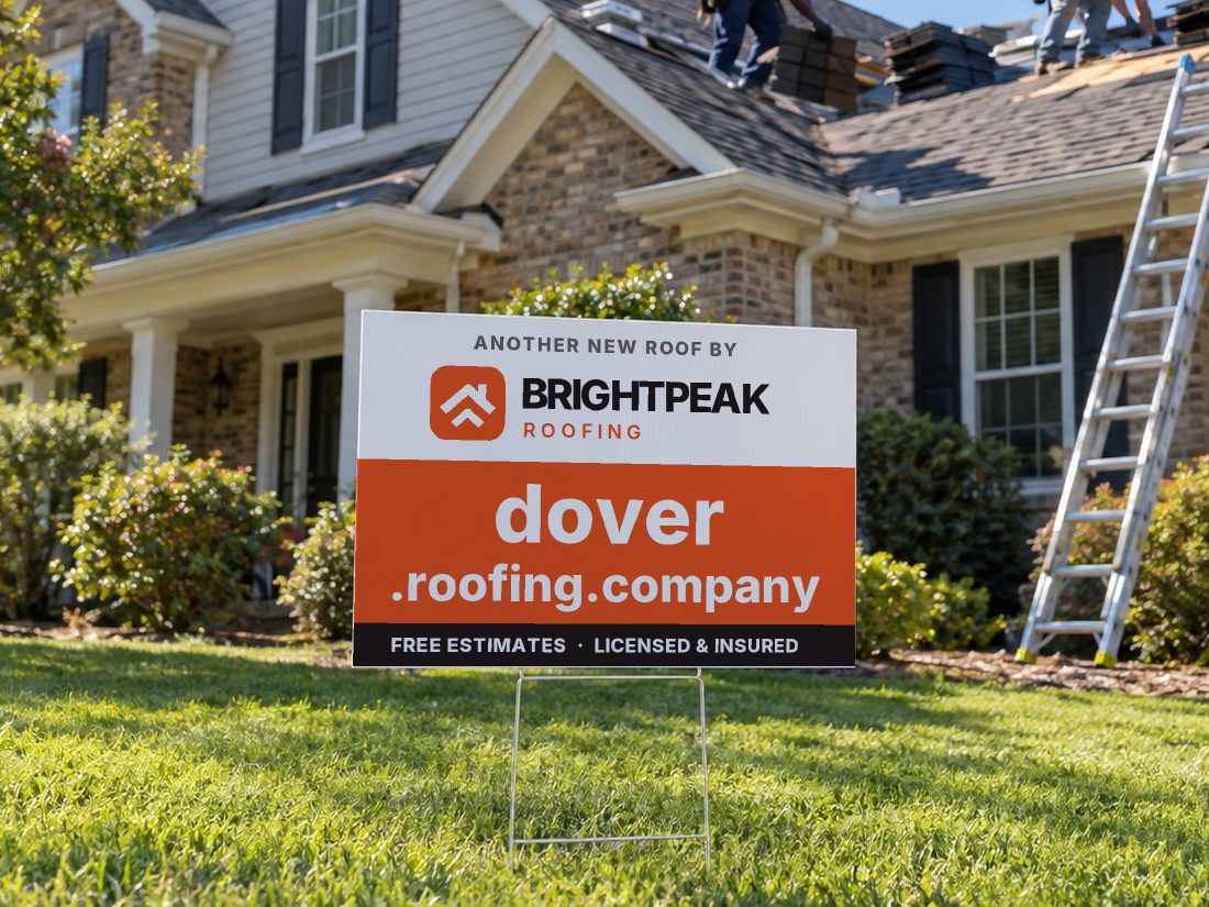 dover.roofing.company on a yard sign in front of a house getting a new roof